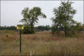 A sign in a field

AI-generated content may be incorrect.
